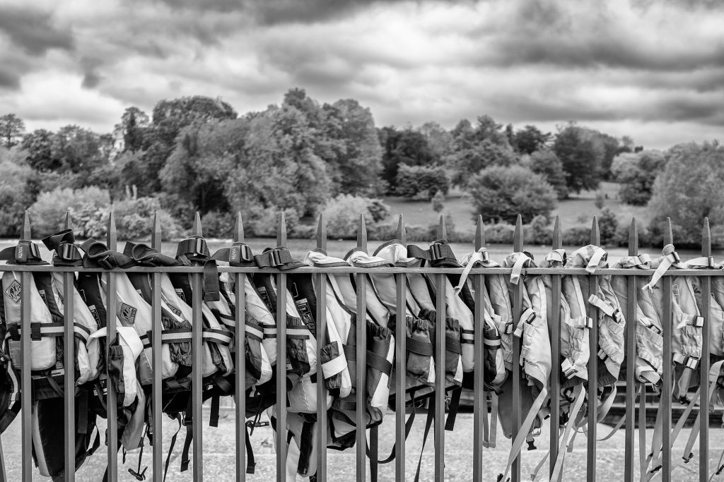 Life jackets tied on to railings by the side of Highfields Lake, Nottingham.